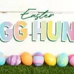 Easter Egg Hunt sign with colorful eggs on grass, promoting family-friendly events at Gulf Waters Beach Front RV Resort.