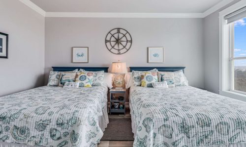 Bright, airy bedroom at Gulf Waters Beach Front RV Resort with ocean views.