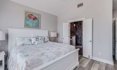 Cozy bedroom at Gulf Waters Beach Front RV Resort with ocean-themed decor.