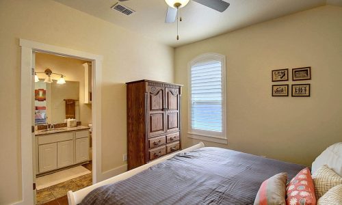 Cozy bedroom at Gulf Waters Beach Front RV Resort with natural light and comfortable bedding.