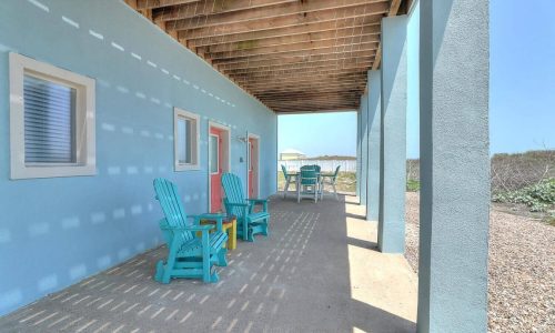 Colorful Adirondack chairs on porch at Gulf Waters Beach Front RV Resort.