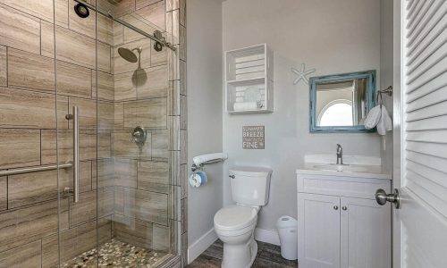Modern bathroom with walk-in shower at Gulf Waters Beach Front RV Resort.