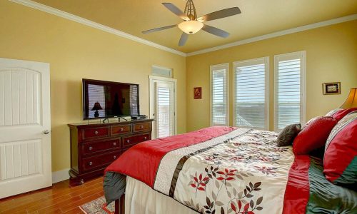 Comfortable bedroom at Gulf Waters Beach Front RV Resort with ocean view.