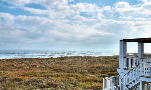 Scenic view of Gulf Waters Beach Front RV Resort with ocean and sky.