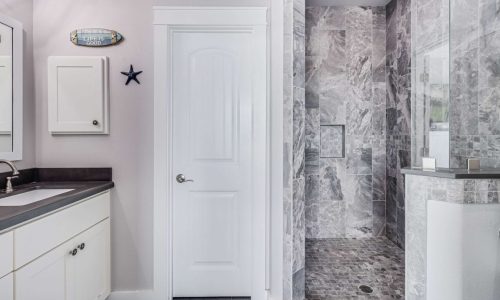 Modern bathroom with walk-in shower at Gulf Waters Beach Front RV Resort.