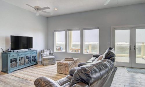 Bright living room with ocean views at Gulf Waters Beach Front RV Resort.