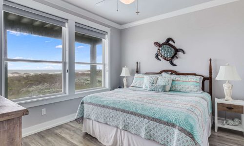 Cozy bedroom with ocean view at Gulf Waters Beach Front RV Resort.