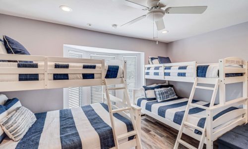 Cozy bunk room at Gulf Waters Beach Front RV Resort with nautical decor.