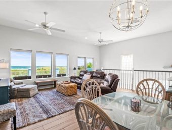 Bright living room with ocean views at Gulf Waters Beach Front RV Resort.