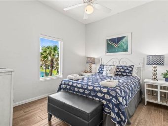 Bright bedroom at Gulf Waters Beach Front RV Resort with ocean view.