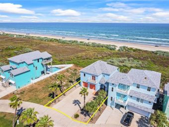 Vacant beachfront lot with palm trees at Gulf Waters RV Resort, ocean view in the background.