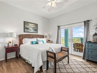 Interior view of a beach front bedroom at Gulf Waters RV Resort with ocean view.