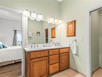 Spacious bathroom with double vanity at Gulf Waters Beach Front RV Resort.