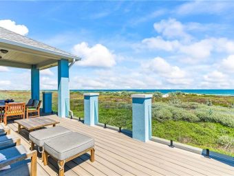 Beachfront deck at Gulf Waters RV Resort with seating and ocean view.