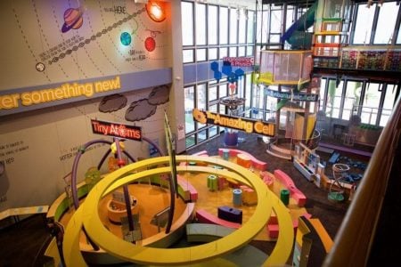 Indoor play area at Gulf Waters Beach Front RV Resort with colorful structures and slides.
