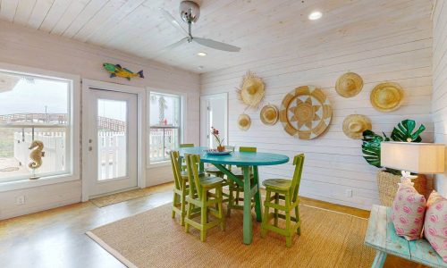 Bright, airy dining area with coastal decor at Gulf Waters RV Resort.