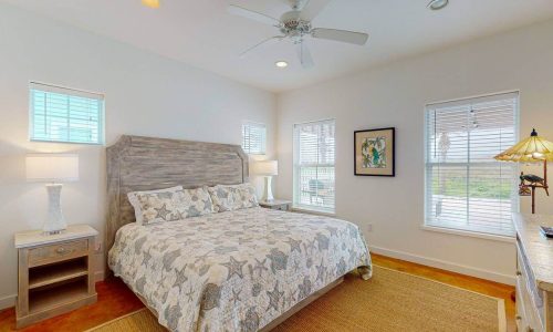 Bright bedroom with beach-themed decor at Gulf Waters Beach Front RV Resort.