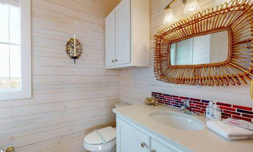 Cozy bathroom at Gulf Waters Beach Front RV Resort with rustic decor.